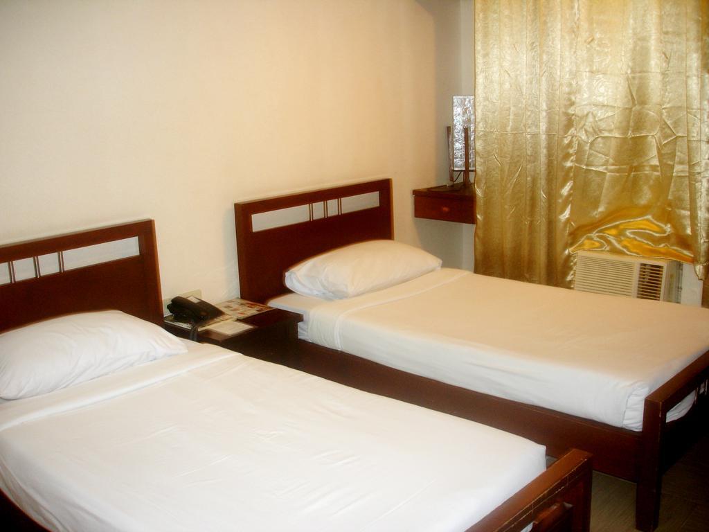 Roxas Midtown Hotel Ruang foto